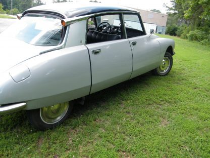 A 1971 Citroen DS 21 Euro Spec is parked in the grass.