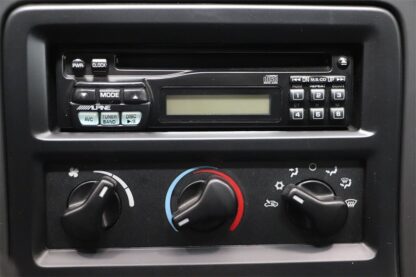 A radio control panel in a car.