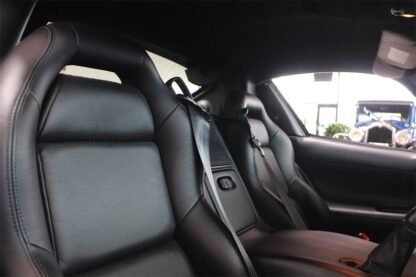 The interior of a black sports car.