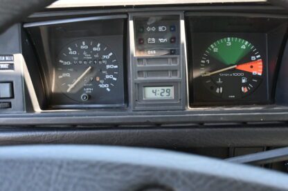 The dashboard of a car with different gauges.