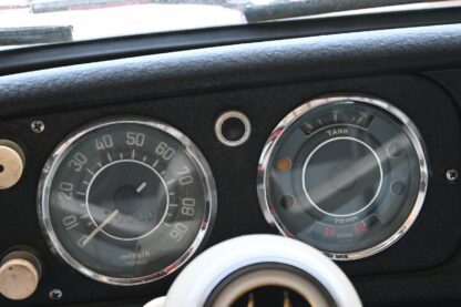 The dashboard of a classic car with gauges and gauges.