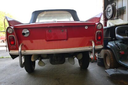An NO RESERVE - - - 1967 AMPHICAR - - - NO RESERVE parked in a garage.