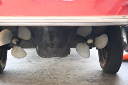 The rear end of a car with propellers on it.