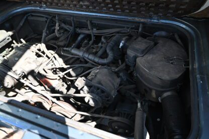 A car engine in the trunk of a car.